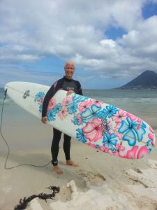 Belinda surfing after chemotherapy for breast cancer on Spider Murphy board